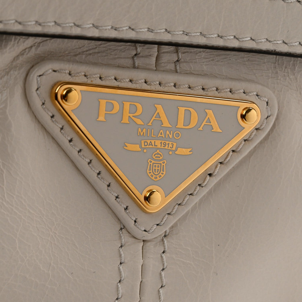 Glossy Calfskin Triangle Mini Bonnie Hand Bag White