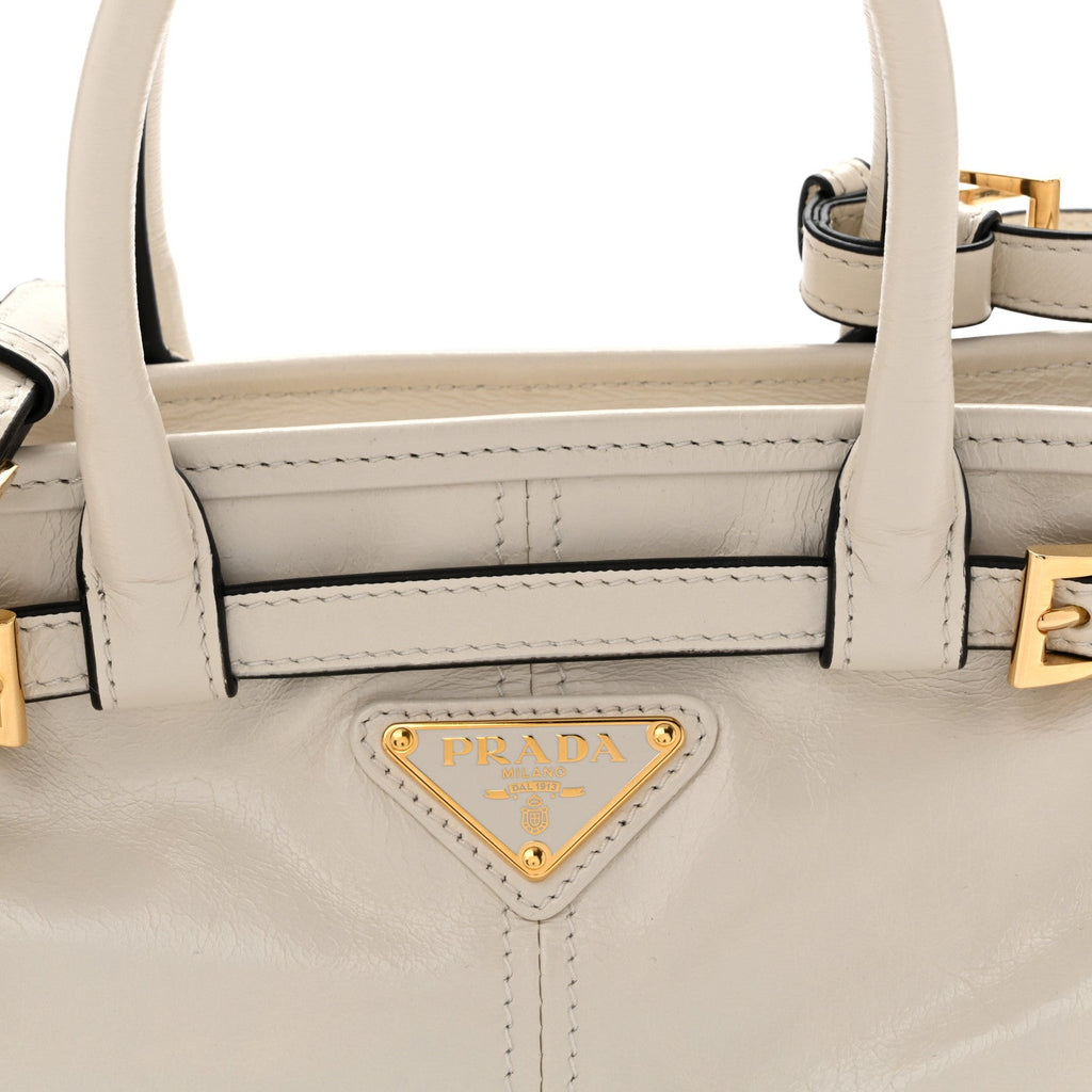 Glossy Calfskin Triangle Mini Bonnie Hand Bag White